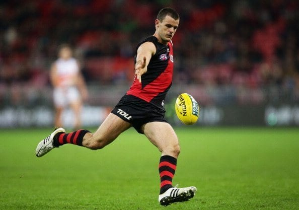 SYDNEY, AUSTRALIA - JUNE 07:  Brent Stanton of the Bombers kicks upfield during the round 12 AFL match between the Greater Western Sydney Giants and the Essendon Bombers at Spotless Stadium on June 7, 2014 in Sydney, Australia.  (Photo by Matt King/Getty Images)