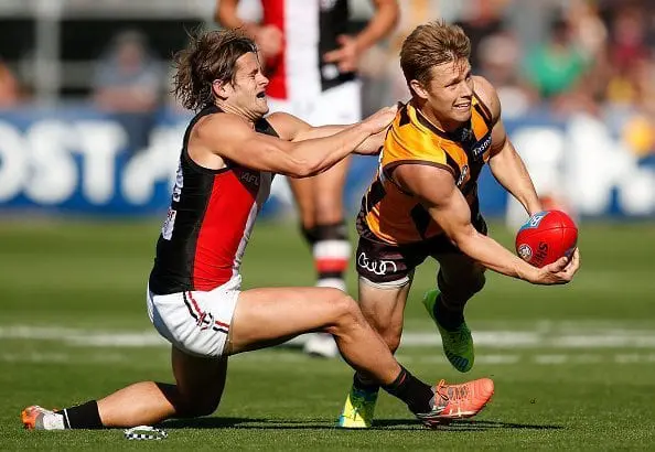 LAUNCESTON, AUSTRALIA - APRIL 16: Sam Mitchell of the Hawks is tackled by Maverick Weller of the Saints during the round four AFL match between the Hawthorn Hawks and the St Kilda Saints at Aurora Stadium on April 16, 2016 in Launceston, Australia. (Photo by Michael Willson/AFL Media/Getty Images)