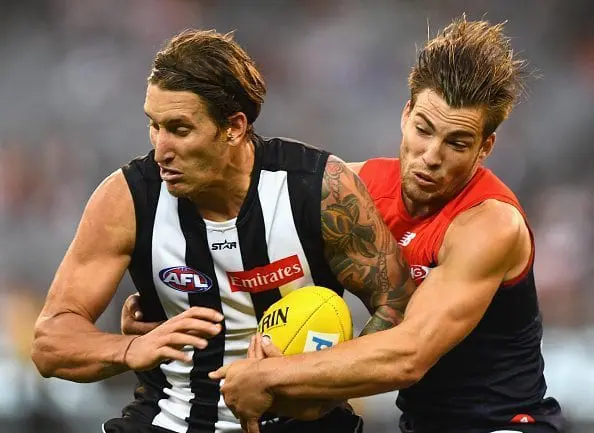MELBOURNE, AUSTRALIA - APRIL 17: Jesse White of the Magpies is tackled by Jack Viney of the Demons during the round four AFL match between the Collingwood Magpies and the Melbourne Demons at Melbourne Cricket Ground on April 17, 2016 in Melbourne, Australia. (Photo by Quinn Rooney/Getty Images)