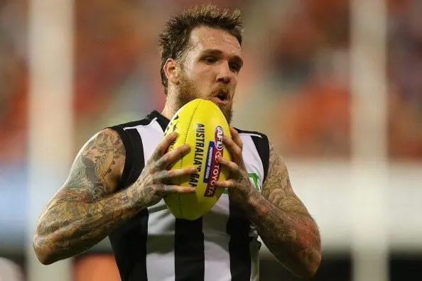 GOLD COAST, AUSTRALIA - JULY 05: Dane Swan of the Magpies takes a mark during the round 16 AFL match between the Gold Coast Suns and the Collingwood Magpies at Metricon Stadium on July 5, 2014 in Gold Coast, Australia. (Photo by Chris Hyde/Getty Images)