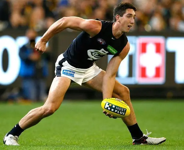 MELBOURNE, AUSTRALIA - MARCH 24: Jacob Weitering of the Blues handpasses the ball during the 2016 AFL Round 01 match between the Richmond Tigers and the Carlton Blues at the Melbourne Cricket Ground, Melbourne on March 24, 2016. (Photo by Adam Trafford/AFL Media/Getty Images)