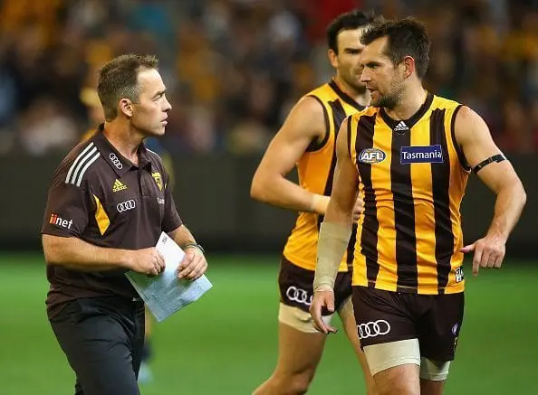 MELBOURNE, AUSTRALIA - APRIL 22: Alastair Clarkson the coach of the Hawks talks to Luke Hodge during the round five AFL match between the Hawthorn Hawks and the Adelaide Crows at Melbourne Cricket Ground on April 22, 2016 in Melbourne, Australia. (Photo by Quinn Rooney/Getty Images)
