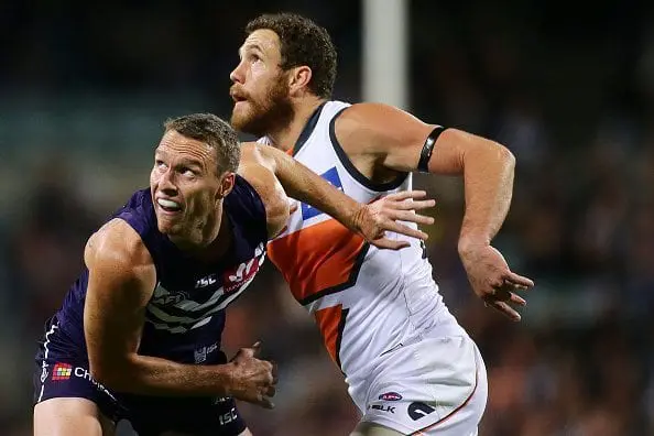 PERTH, WESTERN AUSTRALIA - MAY 07: Jonathon Griffin of the Dockers contests a ruck with Shane Mumford of the Giants during the round seven AFL match between the Fremantle Dockers and the Greater Western Sydney Giants at Domain Stadium on May 7, 2016 in Perth, Australia. (Photo by Will Russell/AFL Media/Getty Images)
