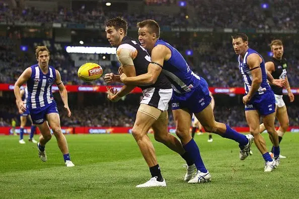MELBOURNE, AUSTRALIA - MAY 21: Dale Thomas of the Blues is tackled by Andrew Swallow of the Kangaroos during the round nine AFL match between the North Melbourne Kangaroos and the Carlton Blues at Etihad Stadium on May 21, 2016 in Melbourne, Australia. (Photo by Scott Barbour/Getty Images)