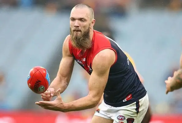 MELBOURNE, AUSTRALIA - JUNE 04: Max Gawn of the Demons passes the ball during the round 11 AFL match between the Hawthorn Hawks and Melbourne Demons at Melbourne Cricket Ground on June 4, 2016 in Melbourne, Australia. (Photo by Scott Barbour/Getty Images)