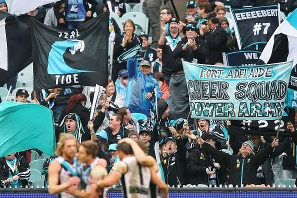 MELBOURNE, AUSTRALIA - JUNE 05: Port Power fans celebrate a goal during the round 11 AFL match between the Collingwood Magpies and the Port Adelaide Power at Melbourne Cricket Ground on June 5, 2016 in Melbourne, Australia. (Photo by Michael Dodge/Getty Images)