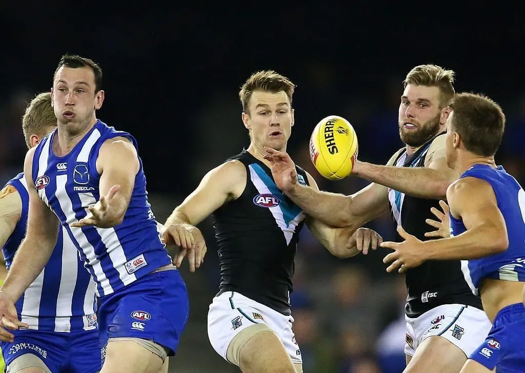 MELBOURNE, AUSTRALIA - JULY 16: Robbie Gray of the Power wins the ball ahead of Todd Goldstein of the Kangaroos and Jackson Trengove of the Power during the round 17 AFL match between the North Melbourne Kangaroos and the Port Adelaide Power at Etihad Stadium on July 16, 2016 in Melbourne, Australia. (Photo by Scott Barbour/Getty Images)