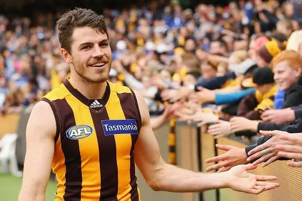 MELBOURNE, AUSTRALIA - AUGUST 13: Isaac Smith of the Hawks celebrates the win with fans during the round 21 AFL match between the Hawthorn Hawks and the North Melbourne Kangaroos at Melbourne Cricket Ground on August 13, 2016 in Melbourne, Australia. (Photo by Michael Dodge/Getty Images)