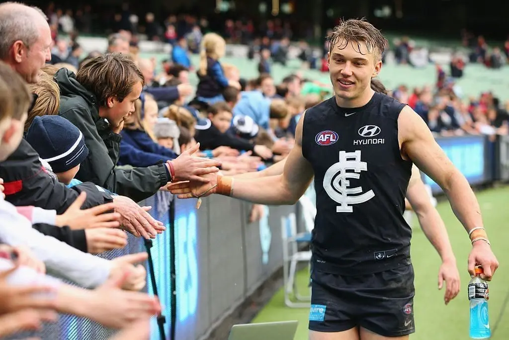 MELBOURNE, AUSTRALIA - AUGUST 21: Patrick Cripps of the Blues celebrates the win with fans during the round 22 AFL match between the Carlton Blues and the Melbourne Demons at Melbourne Cricket Ground on August 21, 2016 in Melbourne, Australia. (Photo by Michael Dodge/Getty Images)