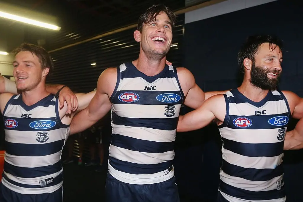 GEELONG, AUSTRALIA - APRIL 30:  Tom Hawkins of the Cats (C)  and Jimmy Bartel (R) sing the club song after winning during the round six AFL match between the Geelong Cats and the Gold Coast Suns at Simonds Stadium on April 30, 2016 in Geelong, Australia.  (Photo by Michael Dodge/Getty Images)