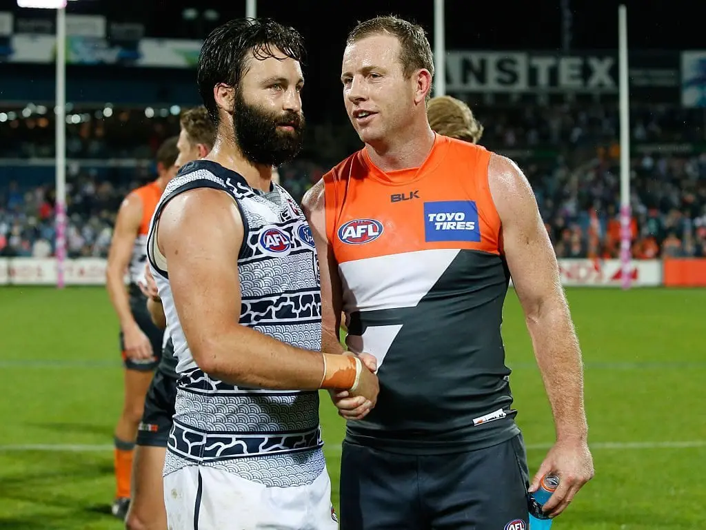 GEELONG, AUSTRALIA - JUNE 04: Jimmy Bartel of the Cats shakes hands with former teammate Steve Johnson of the Giants during the 2016 AFL Round 11 match between the Geelong Cats and the GWS Giants at Simonds Stadium on June 4, 2016 in Geelong, Australia. (Photo by Adam Trafford/AFL Media/Getty Images)