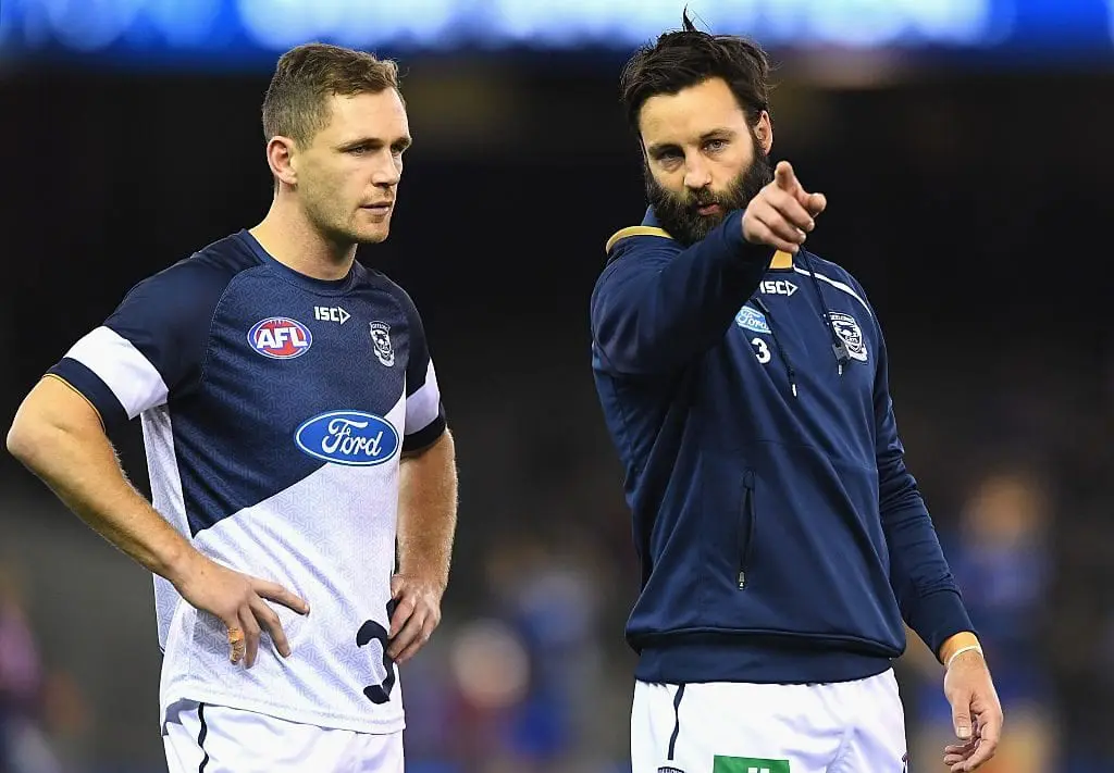 MELBOURNE, AUSTRALIA - JUNE 11: Joel Selwood and Jimmy Bartel of the Cats discuss tactics during the round 12 AFL match between the Geelong Cats and the North Melbourne Kangaroos at Etihad Stadium on June 11, 2016 in Melbourne, Australia.  (Photo by Quinn Rooney/Getty Images)