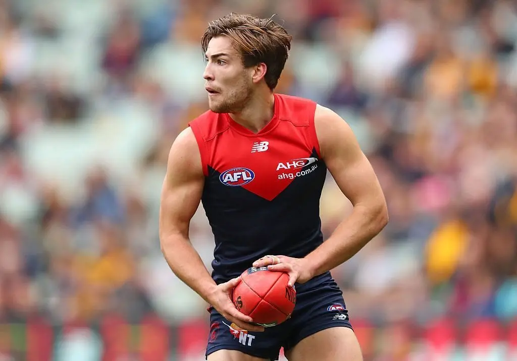 MELBOURNE, AUSTRALIA - AUGUST 06: Jack Viney of the Demons runs with the ball during the round 20 AFL match between the Melbourne Demons and the Hawthorn Hawks at Melbourne Cricket Ground on August 6, 2016 in Melbourne, Australia. (Photo by Scott Barbour/Getty Images)
