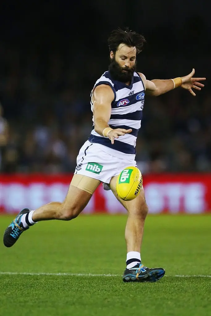 MELBOURNE, AUSTRALIA - AUGUST 07: Jimmy Bartel of the Cats kicks the ball during the round 20 AFL match between the Geelong Cats and the Essendon Bombers at Etihad Stadium on August 7, 2016 in Melbourne, Australia.  (Photo by Michael Dodge/Getty Images)