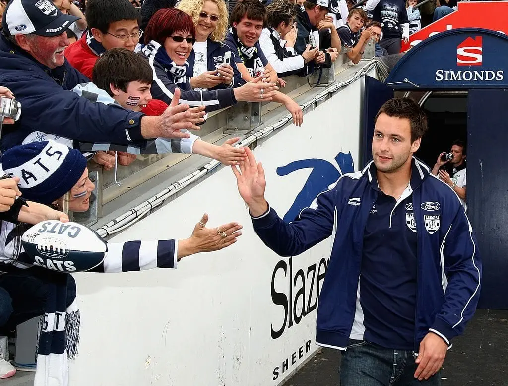 MELBOURNE, AUSTRALIA - SEPTEMBER 30: Geelong Cats player Jimmy Bartel greets fans during a Geelong Cats AFL Premiership Celebration day at Skilled Stadium on September 30, 2007 in Geelong, Australia. (Photo by Mark Dadswell/Getty Images)
