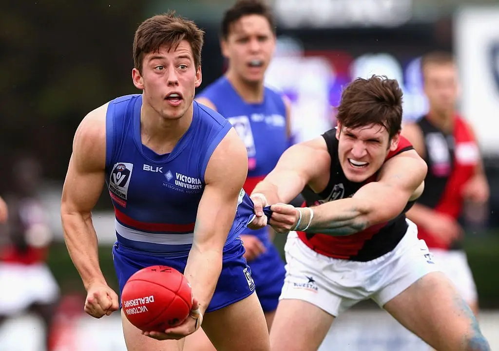 MELBOURNE, AUSTRALIA - SEPTEMBER 12: Nathan Hrovat of Footscray handballs during the VFL Semi Final match between the Footscray Bulldogs and the Essendon Bombers on September 12, 2015 in Melbourne, Australia. (Photo by Robert Prezioso/AFL Media/Getty Images)