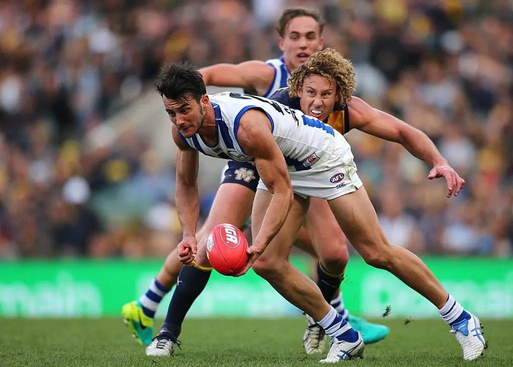 PERTH, AUSTRALIA - JULY 10: Robbie Tarrant of the Kangaroos looks to handball during the round 16 AFL match between the West Coast Eagles and the North Melbourne Kangaroos at Domain Stadium on July 10, 2016 in Perth, Australia. (Photo by Paul Kane/Getty Images)