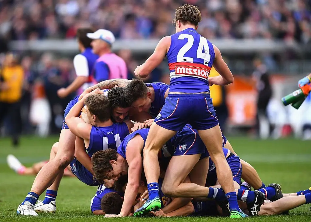 MELBOURNE, AUSTRALIA - OCTOBER 01: The Bulldogs celebrates kicking a goalebrate winning the 2016 AFL Grand Final match between the Sydney Swans and the Western Bulldogs at Melbourne Cricket Ground on October 1, 2016 in Melbourne, Australia. (Photo by Quinn Rooney/Getty Images)