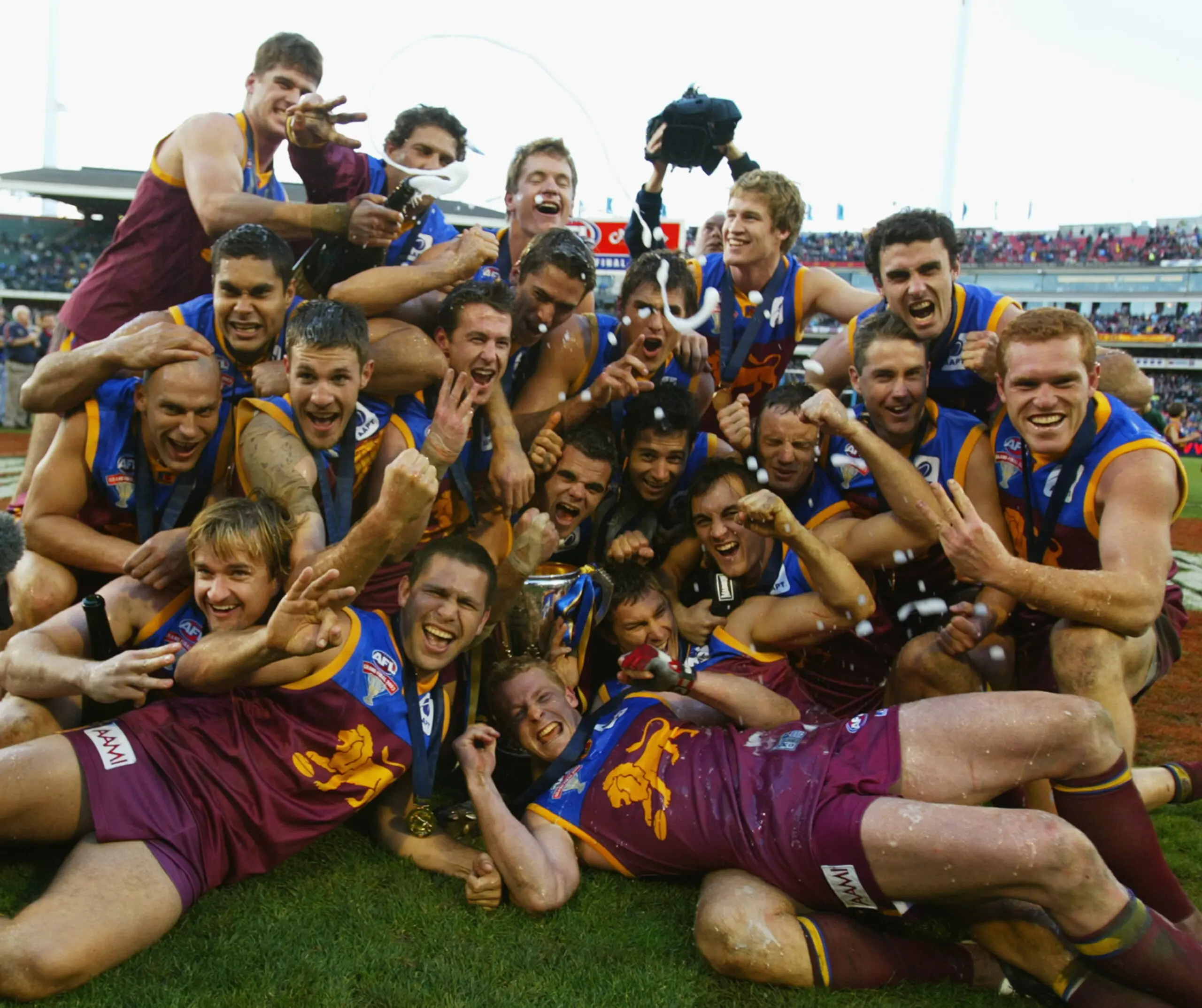 Brisbane celebrate with the trophy
