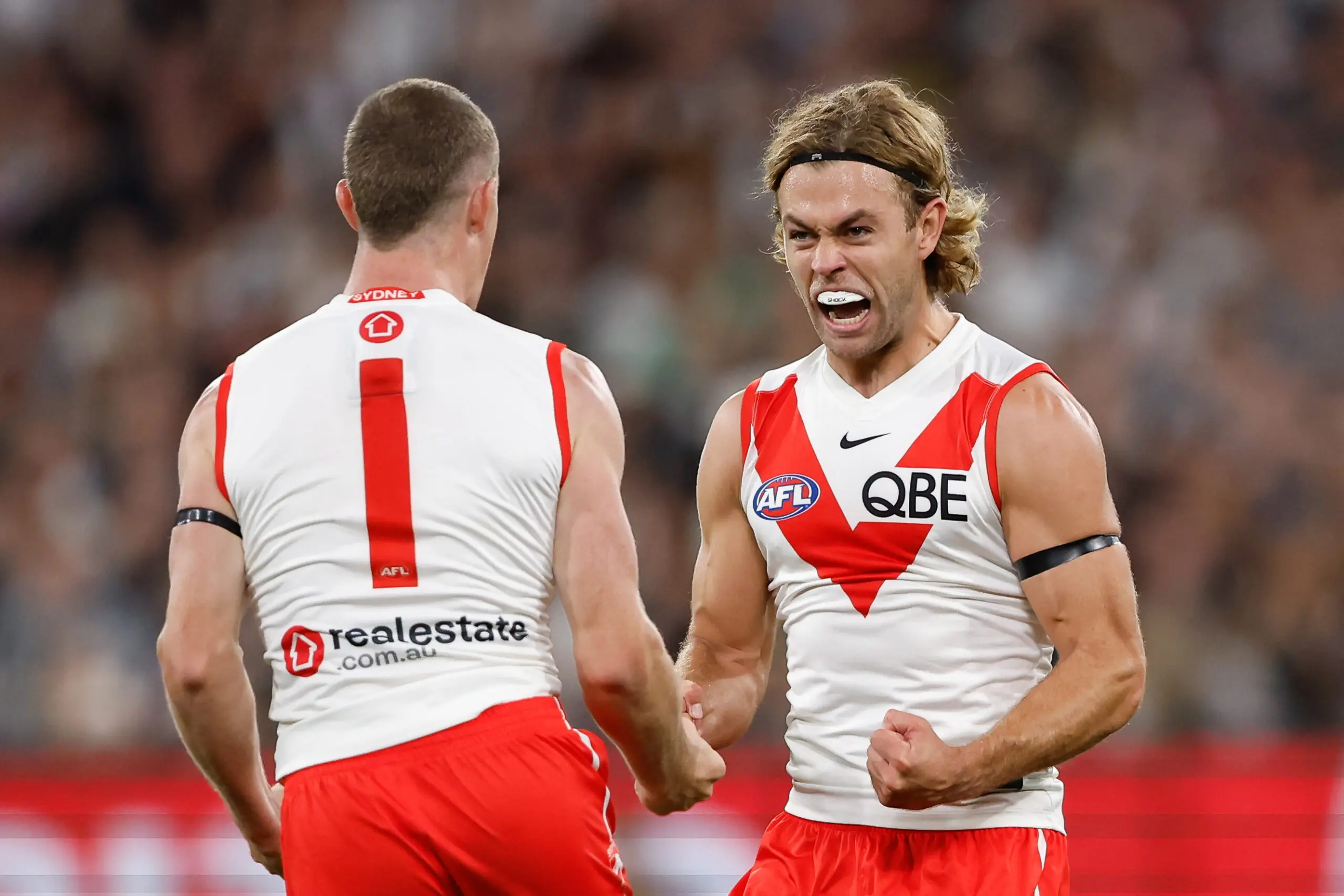 Swans sour reigning premiers' flag unfurling with strong road win