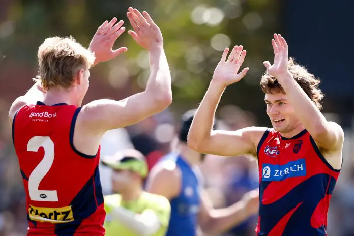 MELBOURNE, AUSTRALIA - FEBRUARY 22: Matthew Jefferson of the Demons celebrates a goal with teammate Jacob van Rooyen during the 2025 AFL match simulation between the North Melbourne Kangaroos and Melbourne Demons at Arden Street on February 22, 2025 in Melbourne, Australia. (Photo by Dylan Burns/AFL Photos via Getty Images)