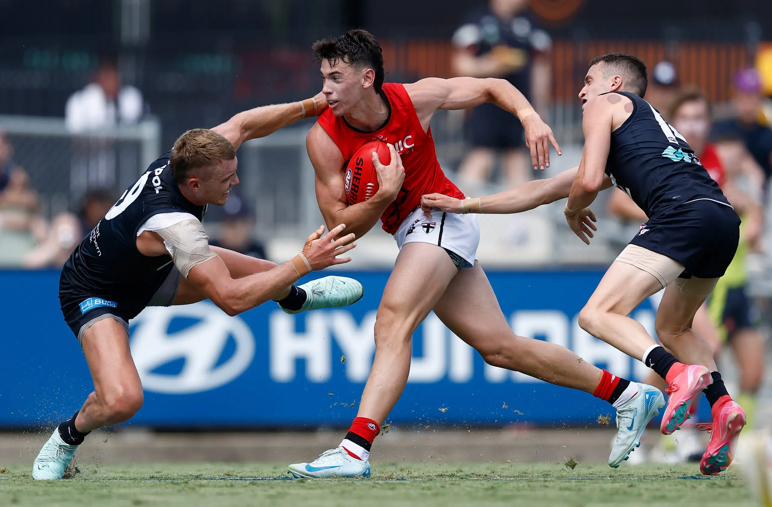 MELBOURNE, AUSTRALIA - FEBRUARY 22: Hugh Boxshall of the Saints fends off Patrick Cripps of the Blues during the 2025 AFL match simulation between the Carlton Blues and St Kilda Saints at Ikon Park on February 22, 2025 in Melbourne, Australia. (Photo by Michael Willson/AFL Photos via Getty Images)