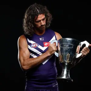 MELBOURNE, AUSTRALIA - FEBRUARY 24: Alex Pearce of the Dockers poses with the Premiership Cup during the 2025 AFL Captains Day at Marvel Stadium on February 24, 2025 in Melbourne, Australia. (Photo by Michael Willson/AFL Photos via Getty Images)