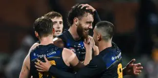 ADELAIDE, AUSTRALIA - JULY 13: Brayden Cook, Riley Thilthorpe and  Josh Rachele of the Crows  celebrates the win   after  the round 18 AFL match between Adelaide Crows and St Kilda Saints at Adelaide Oval, on July 13, 2024, in Adelaide, Australia. (Photo by Mark Brake/Getty Images)