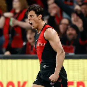 MELBOURNE, AUSTRALIA - AUGUST 10: Jye Caldwell of the Bombers celebrates a goal during the 2024 AFL Round 22 match between the Essendon Bombers and the Gold Coast SUNS at Marvel Stadium on August 10, 2024 in Melbourne, Australia. (Photo by Michael Willson/AFL Photos via Getty Images)