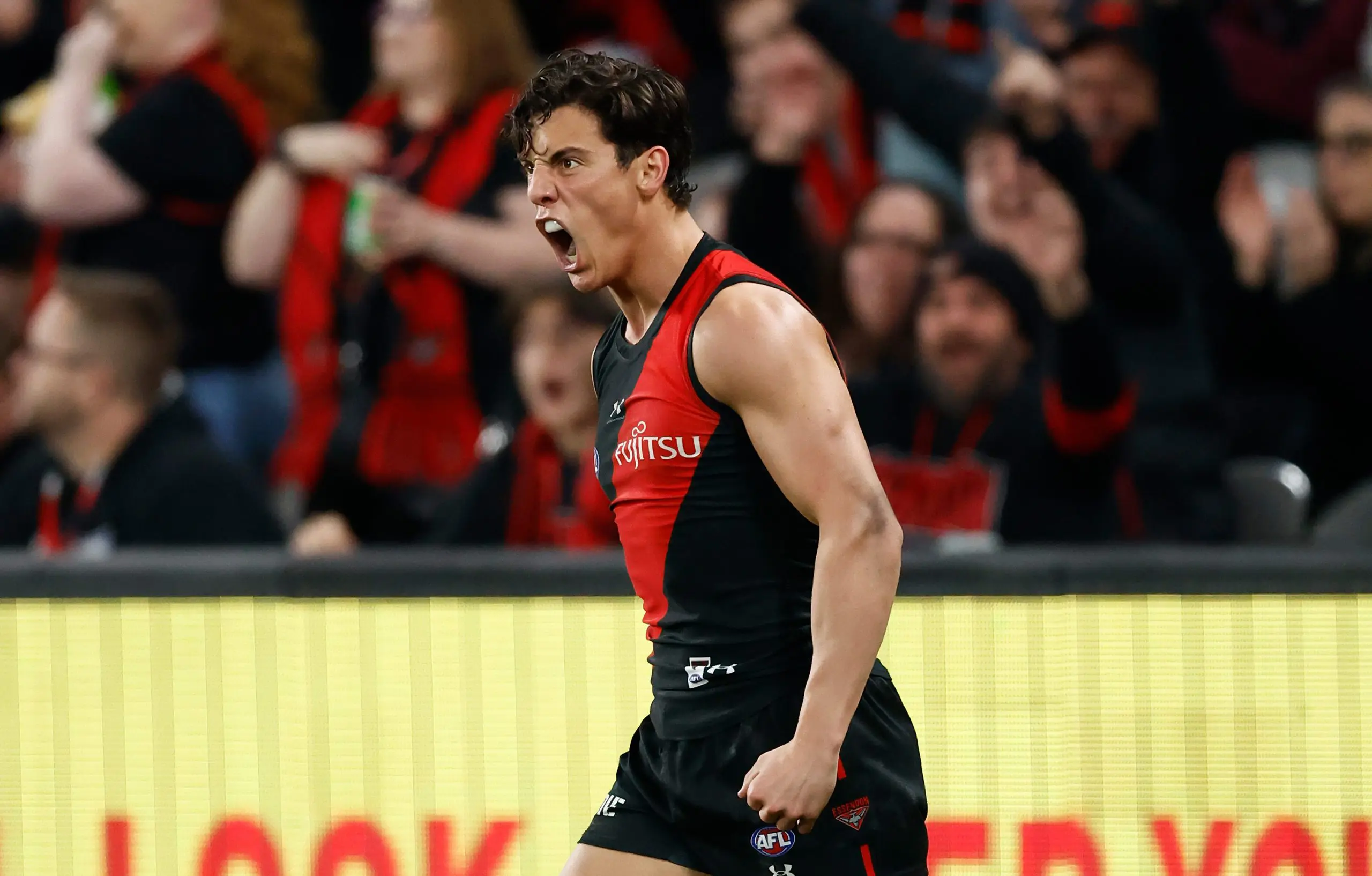 MELBOURNE, AUSTRALIA - AUGUST 10: Jye Caldwell of the Bombers celebrates a goal during the 2024 AFL Round 22 match between the Essendon Bombers and the Gold Coast SUNS at Marvel Stadium on August 10, 2024 in Melbourne, Australia. (Photo by Michael Willson/AFL Photos via Getty Images)