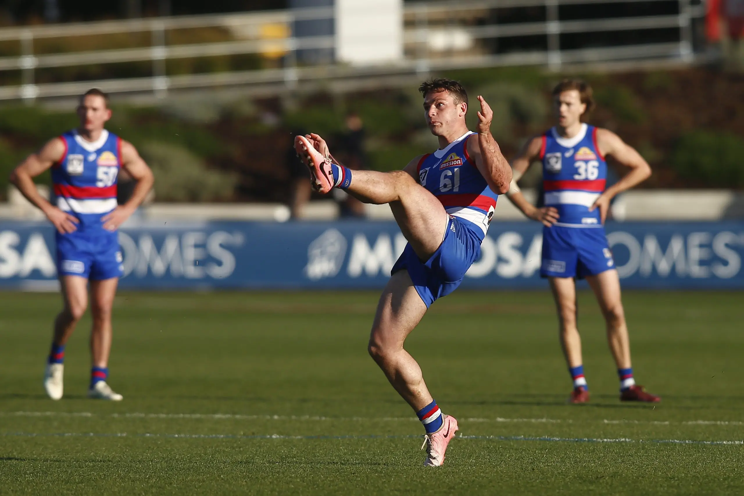 MELBOURNE, AUSTRALIA - SEPTEMBER 14: Cooper Craig-Peters of the Bulldogs kicks for goal during the 2024 VFL Second Preliminary Final match between the Footscray Bulldogs and the Southport Sharks at Mission Whitten Oval on September 14, 2024 in Melbourne, Australia. (Photo by Cameron Grimes/AFL Photos via Getty Images)
