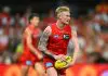GOLD COAST, AUSTRALIA - FEBRUARY 28: John Noble of the Suns looks to kick during the 2025 AAMI AFL Community Series match between Gold Coast Suns and Sydney Swans at People First Stadium on February 28, 2025 in Gold Coast, Australia. (Photo by Matt Roberts/AFL Photos/via Getty Images)