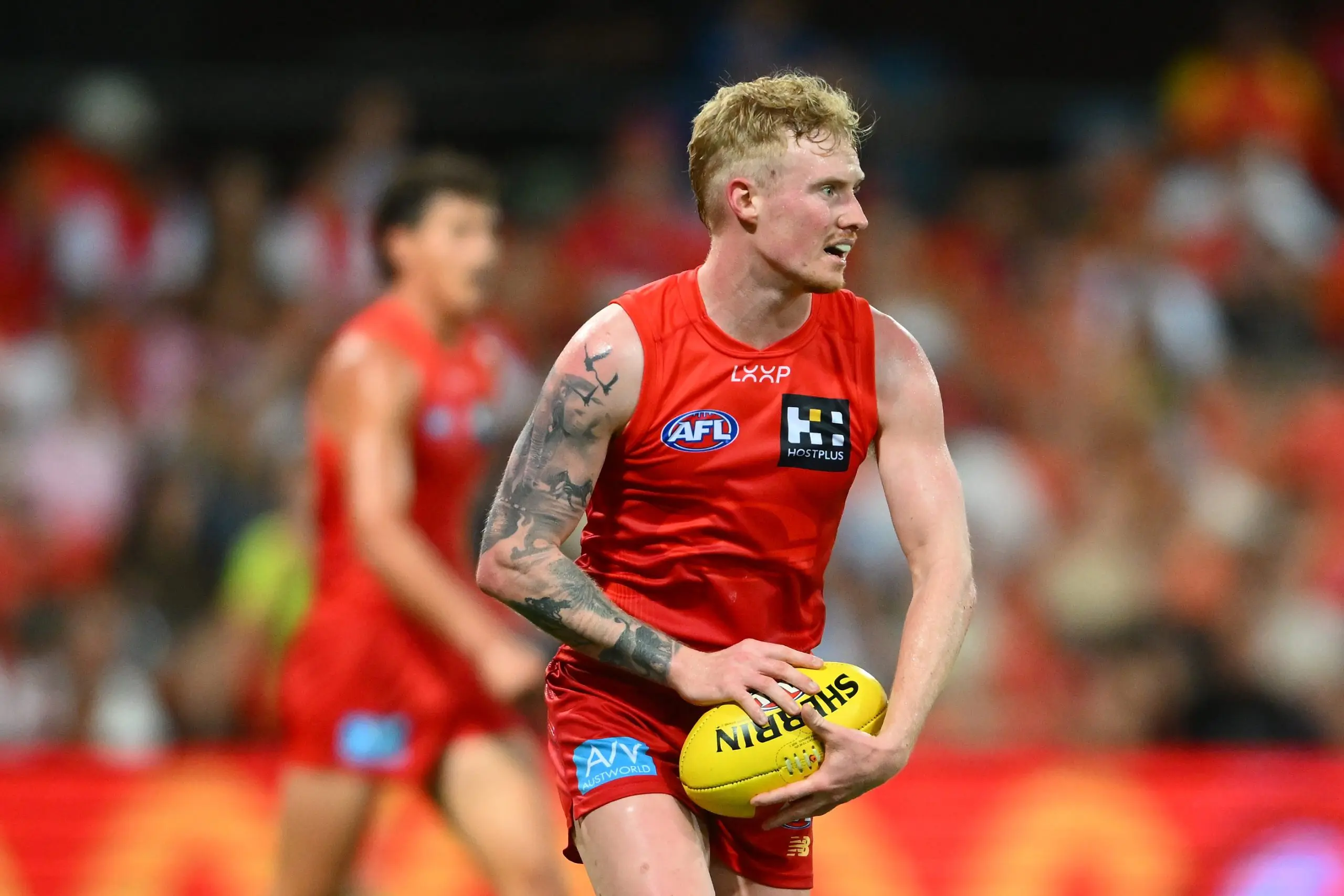 GOLD COAST, AUSTRALIA - FEBRUARY 28: John Noble of the Suns looks to kick during the 2025 AAMI AFL Community Series match between Gold Coast Suns and Sydney Swans at People First Stadium on February 28, 2025 in Gold Coast, Australia. (Photo by Matt Roberts/AFL Photos/via Getty Images)