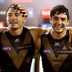 SYDNEY, AUSTRALIA - MARCH 07: Josh Battle and Tom Barrass of the Hawks sing the team song during the 2025 AFL Opening Round match between the Sydney Swans and the Hawthorn Hawks at the Sydney Cricket Ground on March 7, 2025 in Sydney, Australia. (Photo by Michael Willson/AFL Photos via Getty Images)