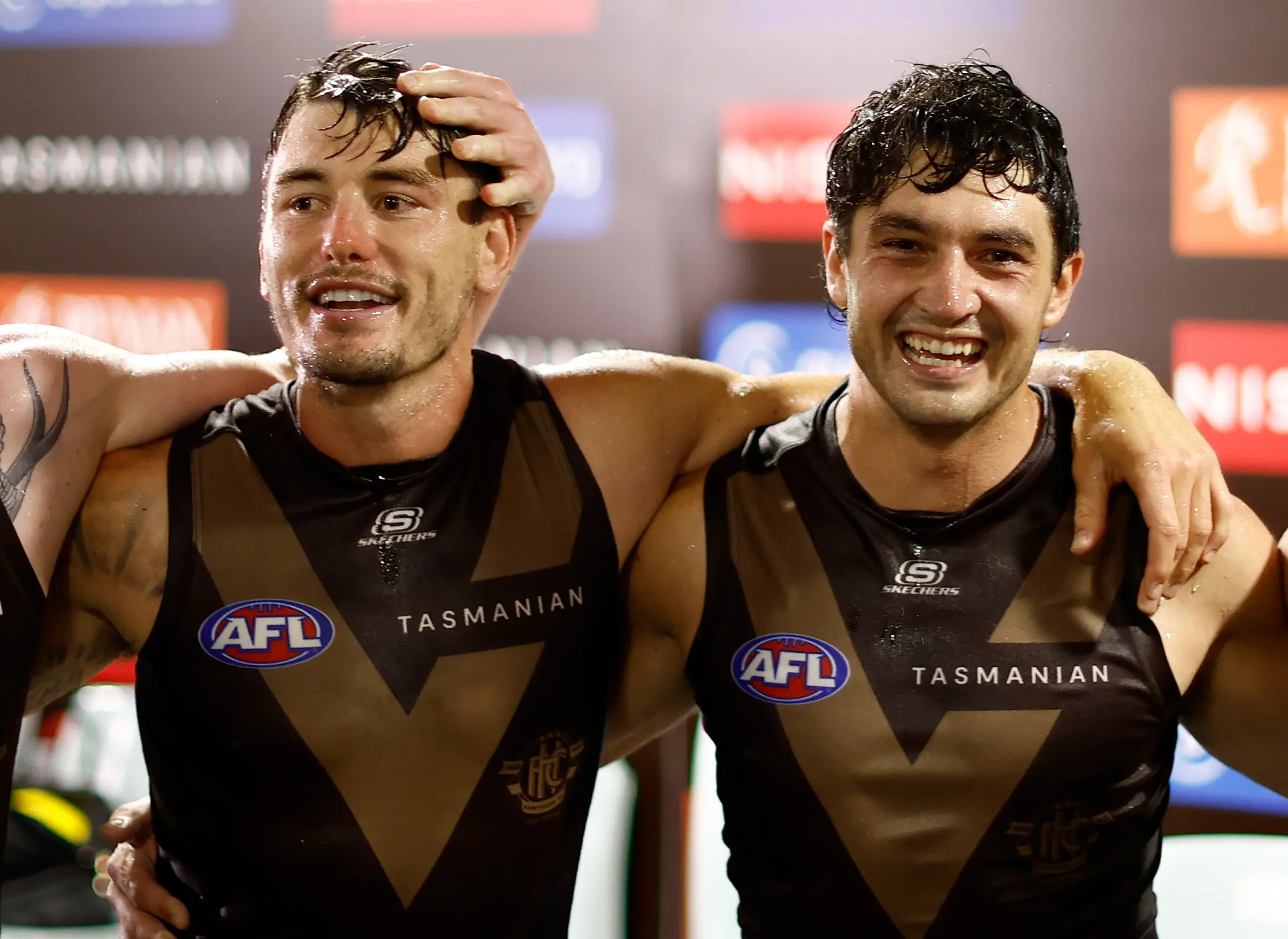 SYDNEY, AUSTRALIA - MARCH 07: Josh Battle and Tom Barrass of the Hawks sing the team song during the 2025 AFL Opening Round match between the Sydney Swans and the Hawthorn Hawks at the Sydney Cricket Ground on March 7, 2025 in Sydney, Australia. (Photo by Michael Willson/AFL Photos via Getty Images)