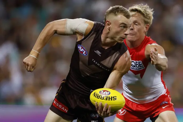 SYDNEY, AUSTRALIA - MARCH 07: James Worpel of the Hawks handballs during the AFL Opening Round match between Sydney Swans and Hawthorn Hawks at Sydney Cricket Ground, on March 07, 2025, in Sydney, Australia. (Photo by Darrian Traynor/AFL Photos/via Getty Images)