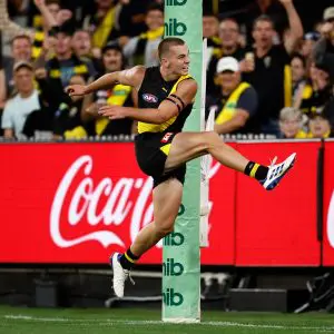 MELBOURNE, AUSTRALIA - MARCH 13: Debutant, Sam Lalor of the Tigers kicks his first league goal during the 2025 AFL Round 01 match between the Richmond Tigers and the Carlton Blues at the Melbourne Cricket Ground on March 13, 2025 in Melbourne, Australia. (Photo by Michael Willson/AFL Photos via Getty Images)