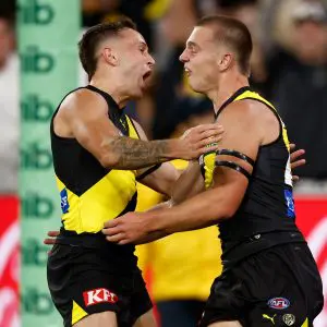 MELBOURNE, AUSTRALIA - MARCH 13: Rhyan Mansell (left) and Sam Lalor of the Tigers celebrate during the 2025 AFL Round 01 match between the Richmond Tigers and the Carlton Blues at the Melbourne Cricket Ground on March 13, 2025 in Melbourne, Australia. (Photo by Michael Willson/AFL Photos via Getty Images)