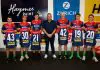 MELBOURNE, AUSTRALIA - MARCH 16: Melbourne Demons debutants Jack Henderson, Harry Sharp, Matthew Jefferson, Aidan Johnson, Harvey Langford and Xavier Lindsay pose for a photo with former player David Schwarz before the 2025 AFL Round 01 match between the Melbourne Demons and the GWS Giants at the Melbourne Cricket Ground on March 16, 2025 in Melbourne, Australia. (Photo by Dylan Burns/AFL Photos via Getty Images)
