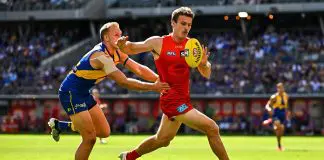 “Really inspirational”: Star Gold Coast defender closing in on AFL return PERTH, AUSTRALIA - MARCH 16: Charlie Ballard of the Suns chases the loose ball in front of Oscar Allen of the Eagles during the 2025 AFL Round 01 match between the West Coast Eagles and the Gold Coast Suns at Optus Stadium on March 16, 2025 in Perth, Australia. (Photo by Daniel Carson/AFL Photos via Getty Images)
