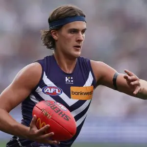 GEELONG, AUSTRALIA - MARCH 15: Murphy Reid of the Dockers runs with the ball during the round one AFL match between Geelong Cats and Fremantle Dockers at GMHBA Stadium, on March 15, 2025, in Geelong, Australia. (Photo by Daniel Pockett/Getty Images)