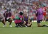 SYDNEY, AUSTRALIA - MARCH 15: Brandon Starcevich of the Lions is helped by medical staff during the round one AFL match between Sydney Swans and Brisbane Lions at Sydney Cricket Ground, on March 15, 2025, in Sydney, Australia. (Photo by Darrian Traynor/AFL Photos/via Getty Images)