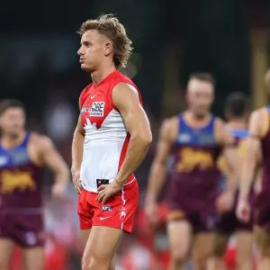 SYDNEY, AUSTRALIA - MARCH 15: Corey Warner of the Swans looks dejected after losing the round one AFL match between Sydney Swans and Brisbane Lions at Sydney Cricket Ground, on March 15, 2025, in Sydney, Australia. (Photo by Cameron Spencer/Getty Images)