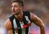 MELBOURNE, AUSTRALIA - MARCH 15: Harry Perryman of the Magpies handballs during the round one AFL match between Collingwood Magpies and Port Adelaide Power at Melbourne Cricket Ground, on March 15, 2025, in Melbourne, Australia. (Photo by Quinn Rooney/Getty Images)