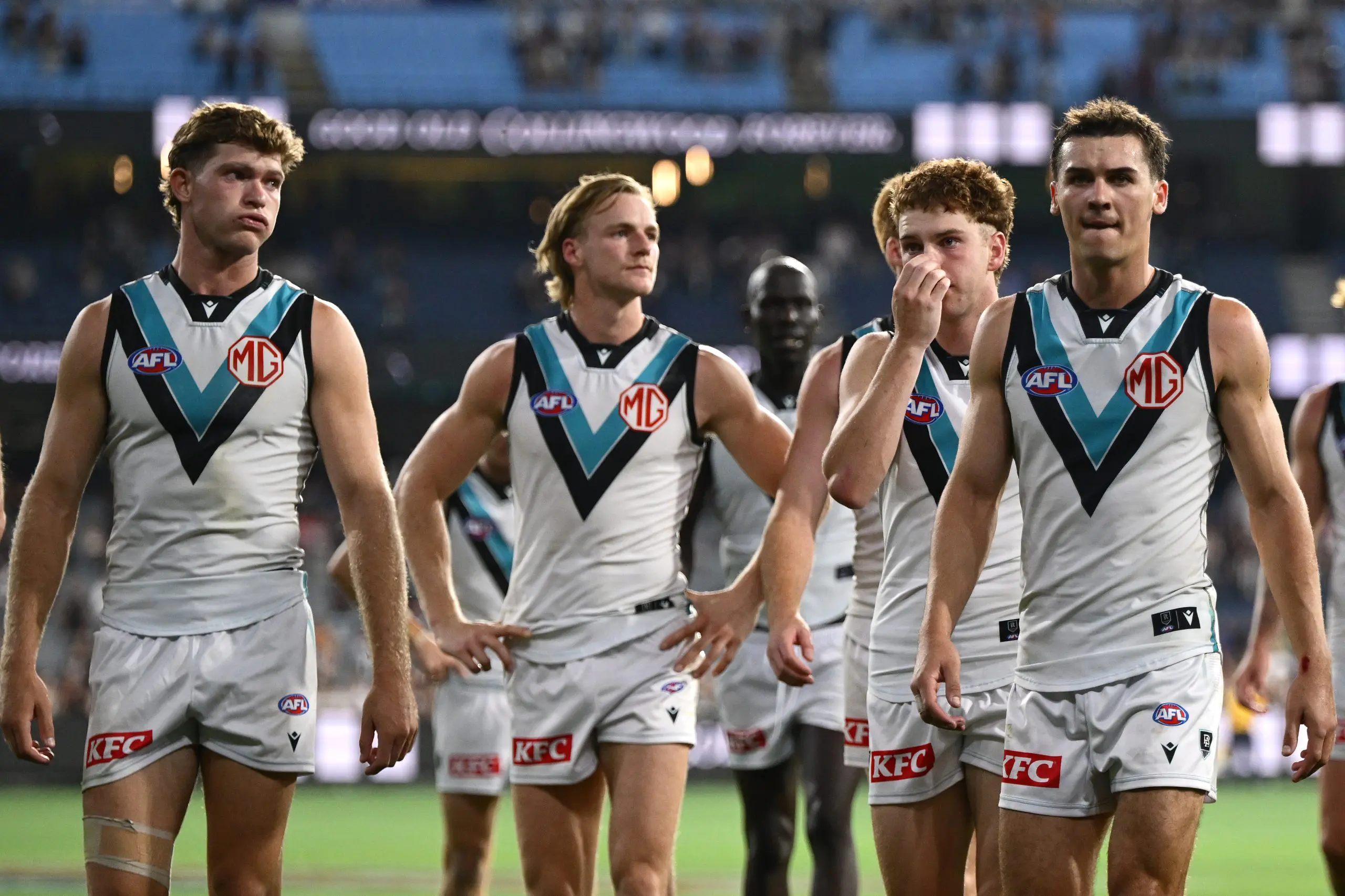 MELBOURNE, AUSTRALIA - MARCH 15: The Power look dejected after losing the round one AFL match between Collingwood Magpies and Port Adelaide Power at Melbourne Cricket Ground, on March 15, 2025, in Melbourne, Australia. (Photo by Quinn Rooney/Getty Images)
