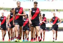 MELBOURNE, AUSTRALIA - MARCH 22: Mason Redman and Zach Merrett of the Bombers walk from the field following the round two AFL match between Essendon Bombers and Adelaide Crows at Melbourne Cricket Ground, on March 22, 2025, in Melbourne, Australia. (Photo by Morgan Hancock/AFL Photos/via Getty Images)