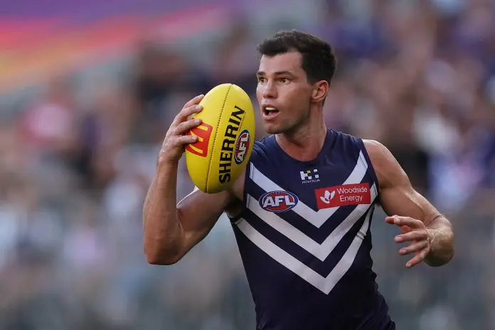 PERTH, AUSTRALIA - MARCH 23: Jaeger O'Meara of the Dockers in action during the round two AFL match between Fremantle Dockers and Sydney Swans at Perth Stadium, on March 23, 2025, in Perth, Australia. (Photo by Paul Kane/Getty Images)