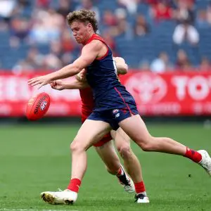MELBOURNE, AUSTRALIA - MARCH 29: Harvey Langford of the Demons kicks during the round three AFL match between Melbourne Demons and Gold Coast Suns at Melbourne Cricket Ground, on March 29, 2025, in Melbourne, Australia. (Photo by Josh Chadwick/AFL Photos/via Getty Images)
