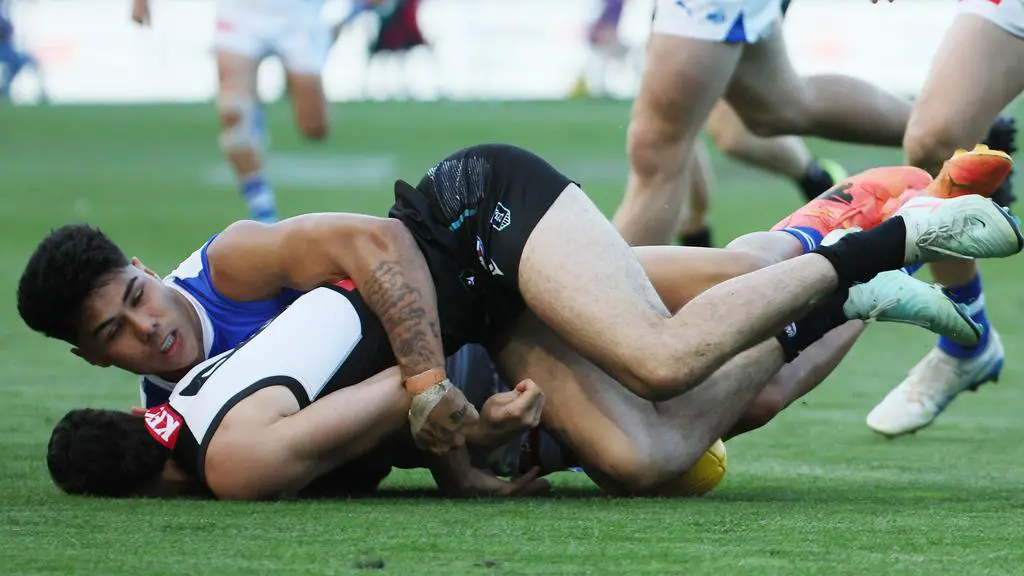 The Paul Curtis tackle on Josh Sinn. Picture: James Elsby/AFL Photos via Getty Images