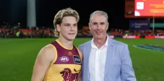 GOLD COAST, AUSTRALIA - JULY 27: Will Ashcroft of the Lions and father Marcus Ashcroft pose for a photo during the 2024 AFL Round 20 match between the Gold Coast SUNS and the Brisbane Lions at People First Stadium on July 27, 2024 in Gold Coast, Australia. (Photo by Russell Freeman/AFL Photos via Getty Images)